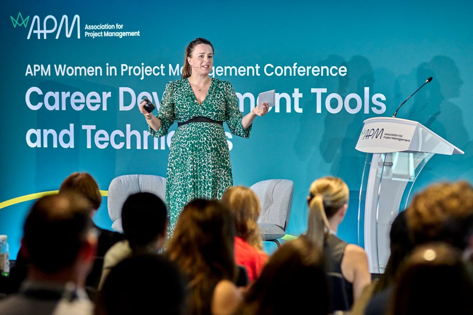Rachael speaking on stage at the APM Women in Project Management Conference